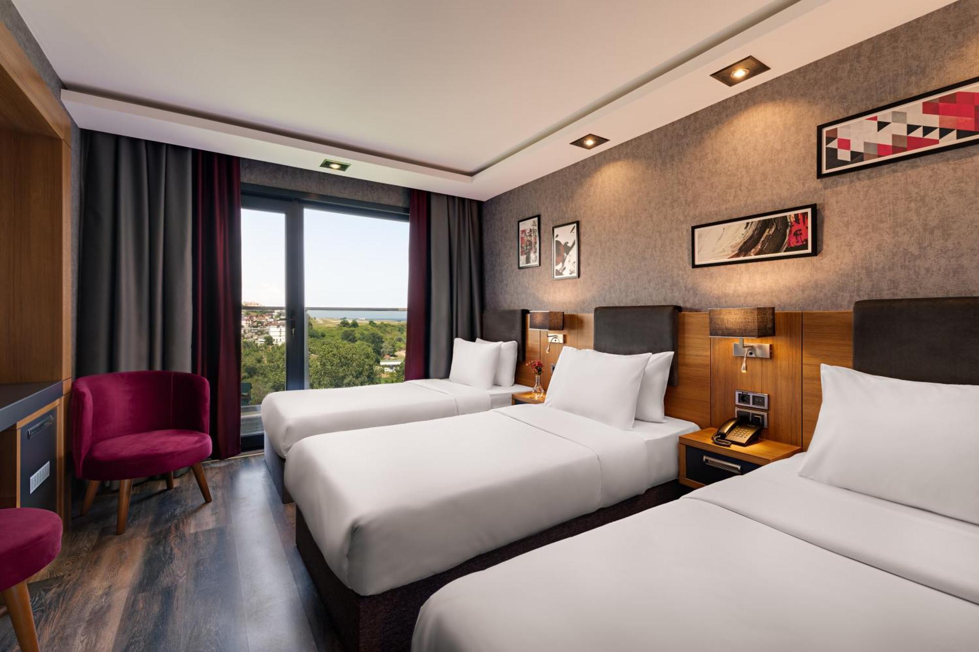 รอยัล เอซิส สวีท โฮเต็ล ทรับซอน Hotel ห้อง รูปภาพ